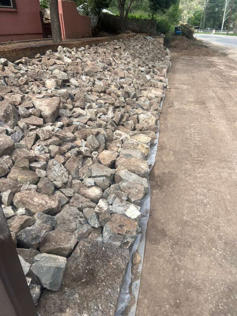 Completed rockscaping project by JTEX Construction
